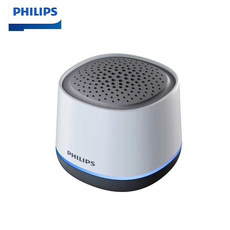 Philips TAS1009 white and gray Bluetooth portable desktop speaker with perforated grille, blue LED ring, and 1200mAh battery