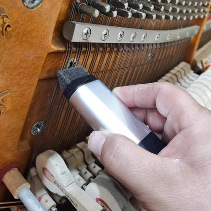 Silver and black piano tuning brush with soft gray bristle head for effective piano string rust removal tool use