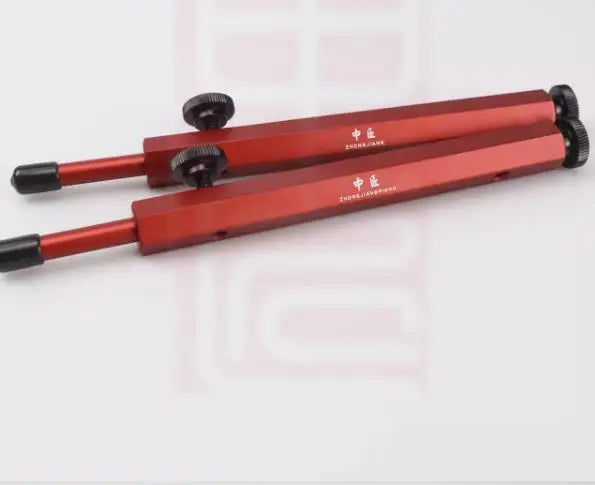 Red metal caliper with black adjustment knobs for upright piano action repair stands and piano action repair parts