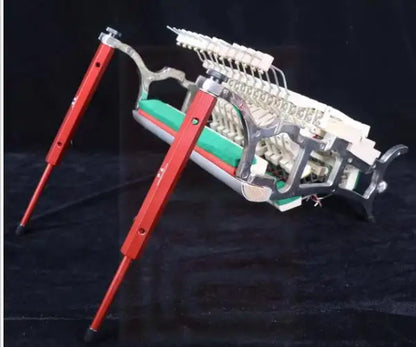 Red metal upright piano action repair stand with silver frame and green internal components for piano tools use
