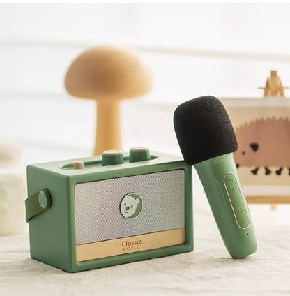Mint green vintage-style portable speaker with bear face grille and matching microphone for piano wooden boys play mechanical music