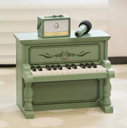 Mint green piano wooden boys can play mechanical music with ornate floral detailing and vintage radio at beat music store