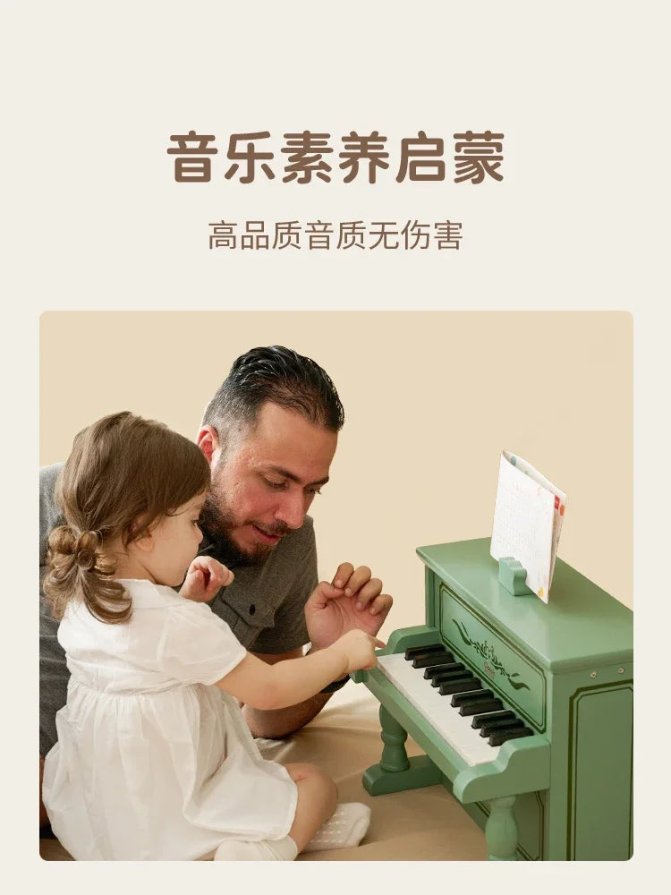 A small mint-green wooden piano with black and white keys for boys to play mechanical music from beat music store