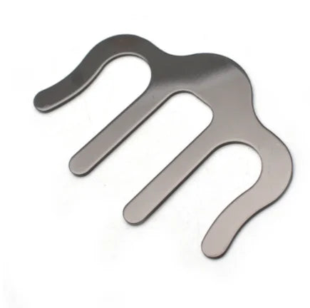Silver metallic three-prong hair comb with polished finish used as pianos stands song holder clip music and speech draft cooking aid