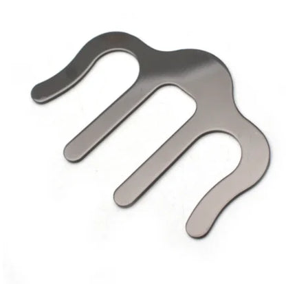 Silver metallic three-prong hair comb with polished finish used as pianos stands song holder clip music and speech draft cooking aid