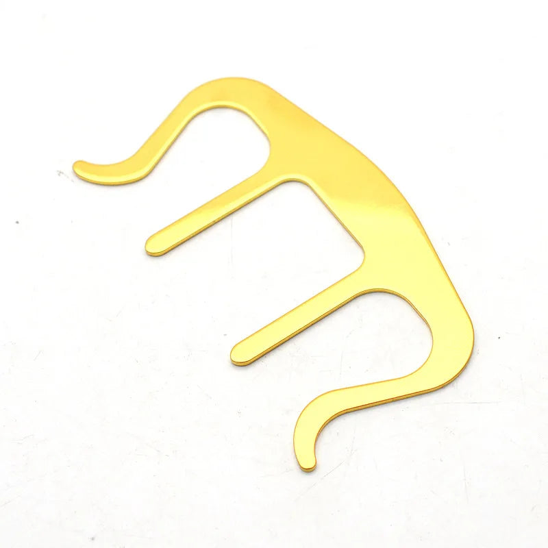 Gold-colored metallic earbud removal tool with sleek curved design for pianos stands song holder clip music and speech draft cooking use