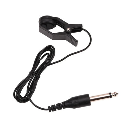 Picture shows black plastic clip-on guitar pickup adapter with coiled cable and 6.35mm audio jack connector