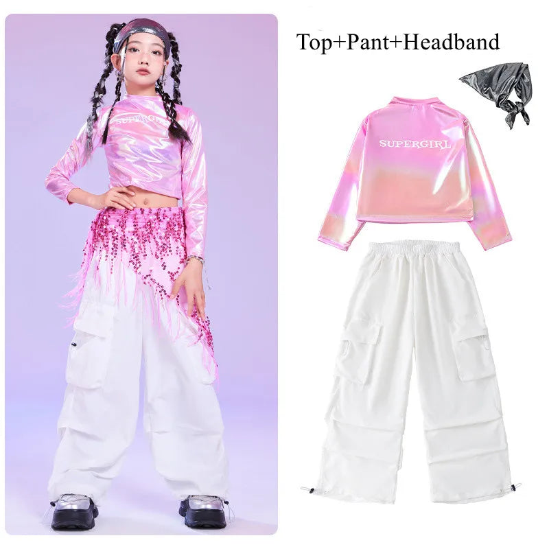 Pink hip hop long sleeve laser crop top with supergirl print paired with white pant and sequin hip scarf for kids stage wear