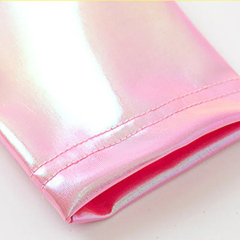 A shimmering pink hip hop long sleeve laser crop top with glossy sequin hip scarf and visible stitching detail
