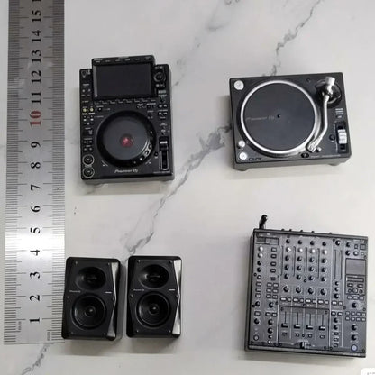 Black miniature pioneer dj controller set featuring mixer player keychain and two speakers in detailed model form