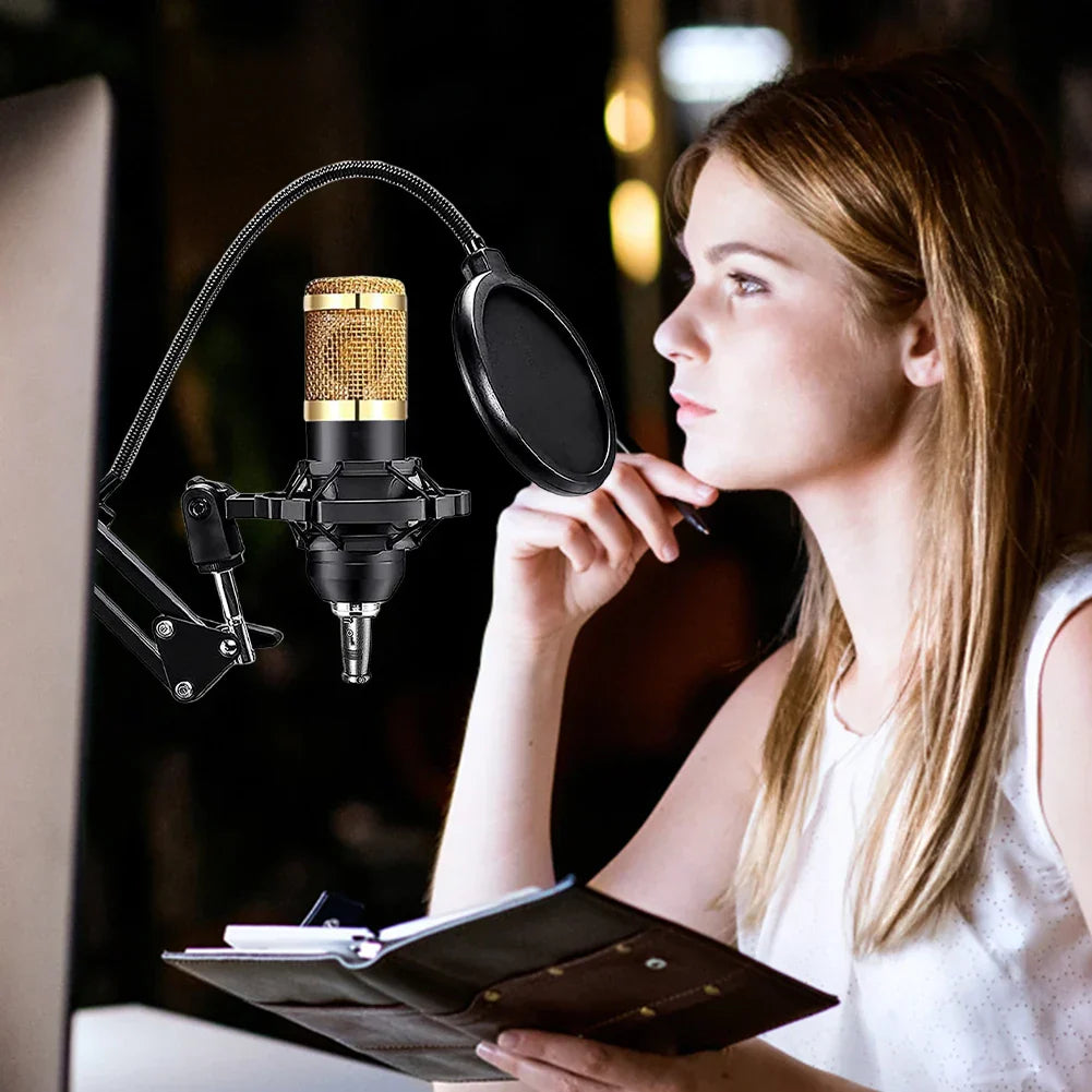 Gold bm800 microphone with black pop filter metal shock mount and adjustable arm in podcast equipment bundle on desk