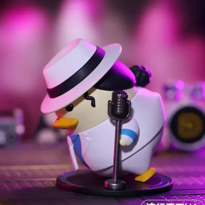 A white duckoo figurine wearing a black-trimmed fedora and white suit posed singing into a vintage microphone from pop mart duckoo music festival mystery box toys