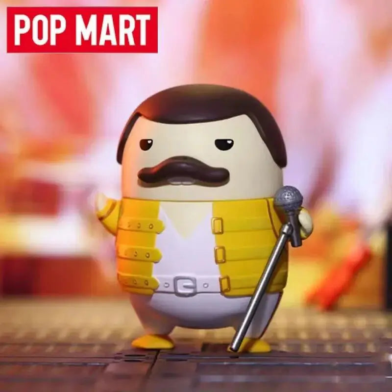 A charming yellow and white pop mart duckoo music festival figurine dressed as freddie mercury holding a microphone