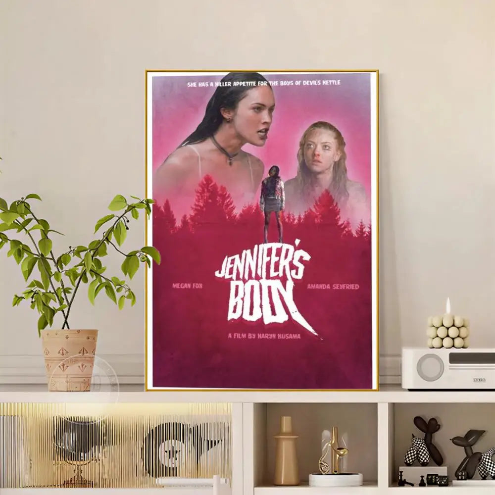 A framed pop movie jennifer body poster with vibrant pink and red gradient and modern graphic featuring megan fox and amanda seyfried