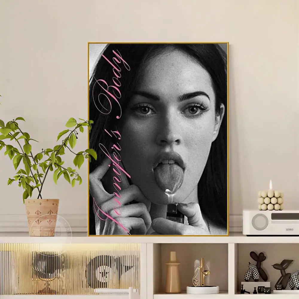 Black and white framed portrait of megan fox with pink cursive jennifers body text modern graphic pop movie poster