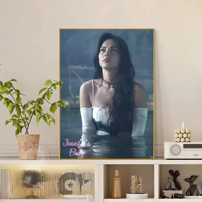 A framed pop movie Jennifer body poster with modern graphic featuring a woman in white gloves against blue water backdrop