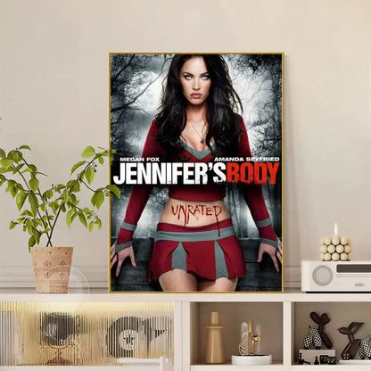 A framed modern graphic pop movie Jennifer Body poster with blood-like text on Megan Fox in red and gray outfit