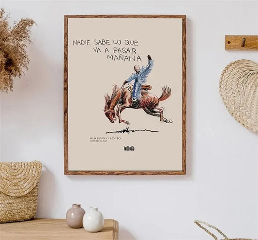 A framed canvas art print with a beige background featuring a blue and brown rider on rearing horse illustration for room decor