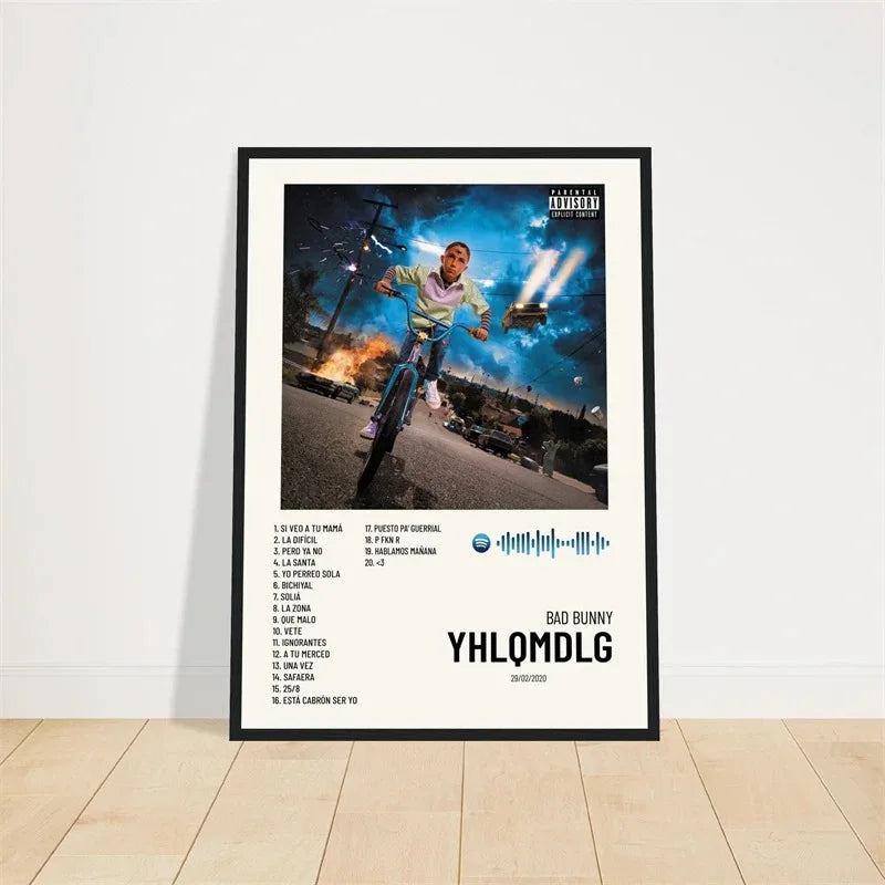 Black-framed canvas poster featuring bad bunny yhlqmdlg album cover with dynamic bike ride and nighttime cityscape backdrop