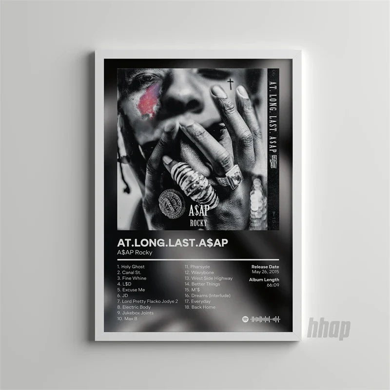 Black-and-white framed poster of asap rocky with pink eye makeup and rings showcasing the album at long last asap