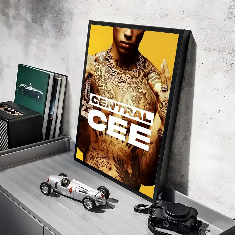 A framed pop rapper central cee hd linen canvas poster with intricate tattoos and bold white text on a yellow background featuring lighting effects perfect for living room bedroom office decoration or gift delivered within working days
