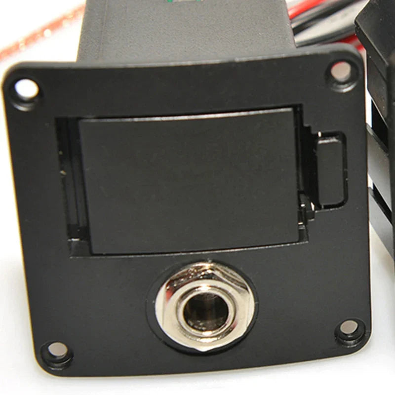 Black rectangular guitar pickup cover with hinged lid and silver 6.35mm jack for popular Fishman guitars guitar ISYS+ EQ preamp system