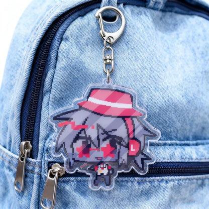 A clear acrylic cartoon chibi keychain with gray hair, red and white striped hat, and star-shaped eyes for bag charms