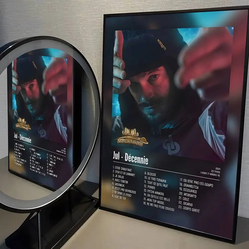 A framed poster of popular music rapper j jul in a black cap and maroon shirt for posters aesthetic wall and living room decor