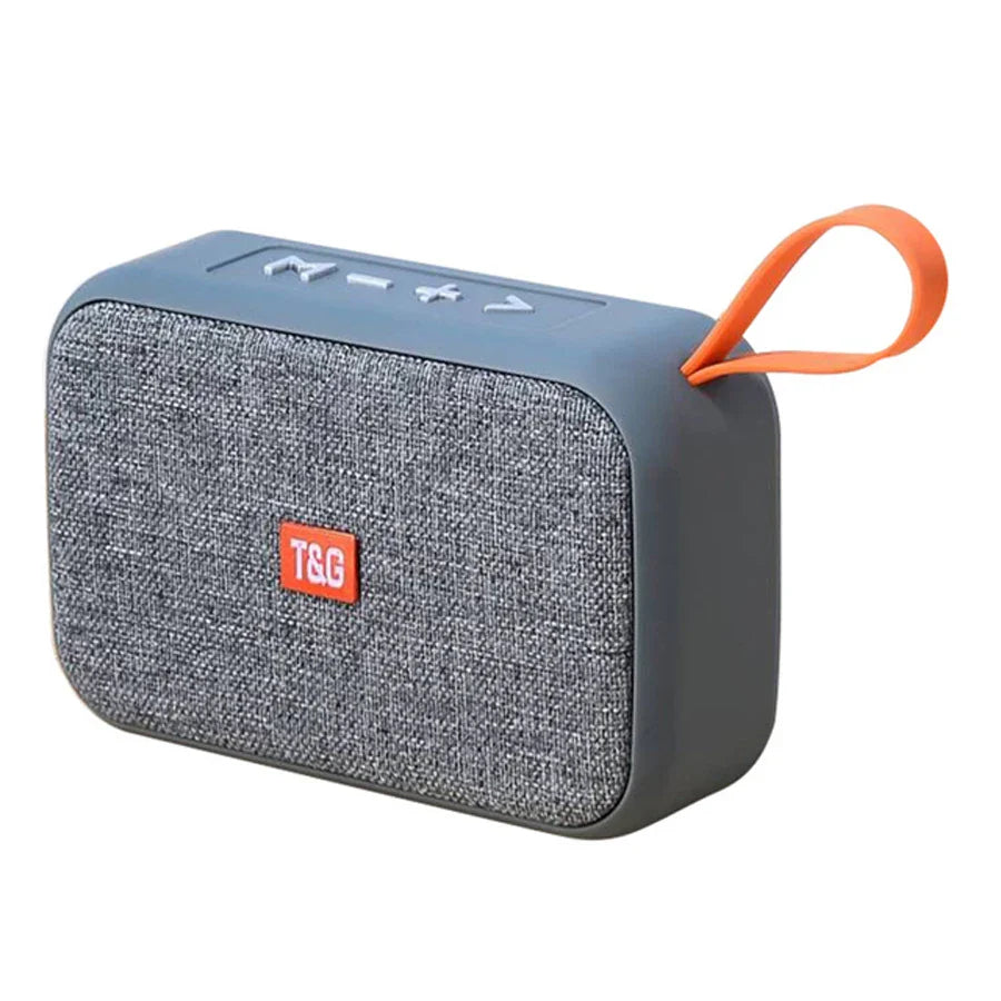 Gray textured fabric portable bluetooth speaker with orange accent strap and t&g logo wireless waterproof subwoofer