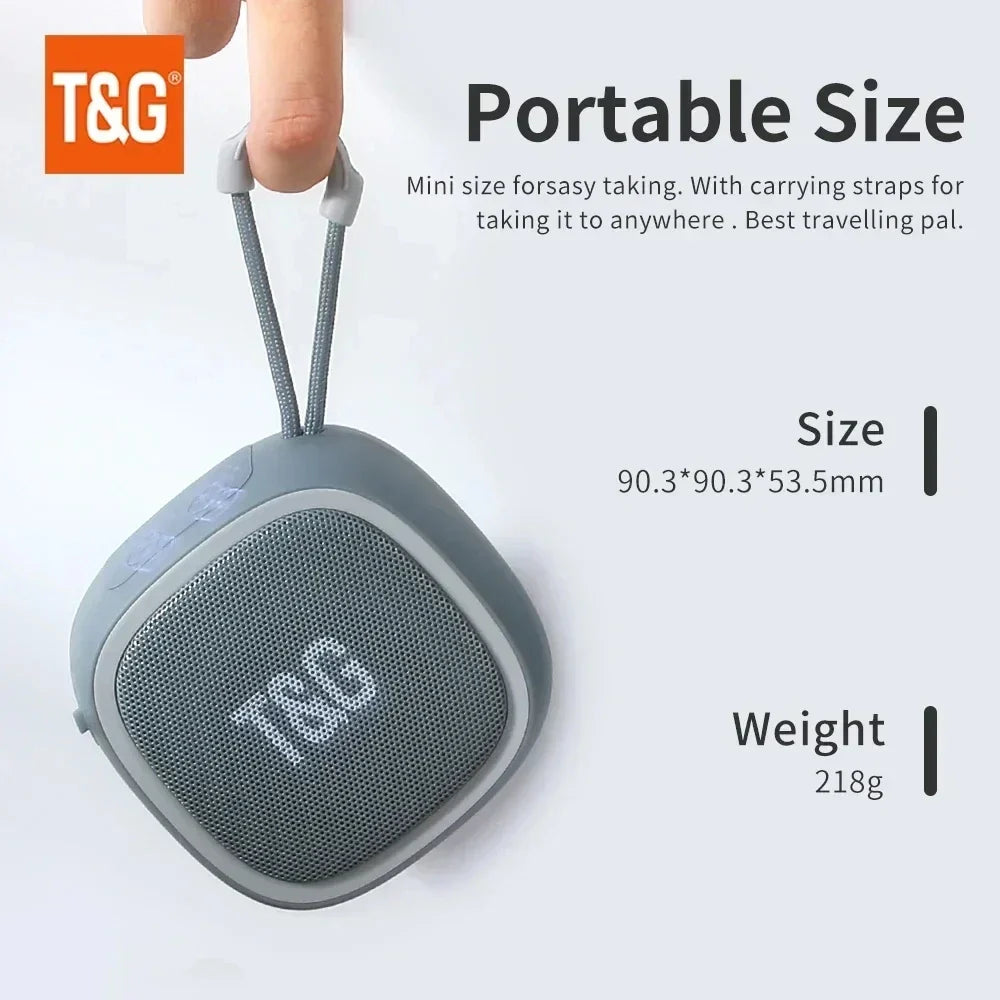 Gray portable bluetooth speaker with textured mesh grille and soft silicone casing wireless waterproof subwoofer radio fm mini