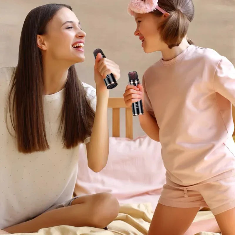 Black handheld wireless bluetooth karaoke microphone with silver mesh grille for car mini bluetooth live broadcast equipment