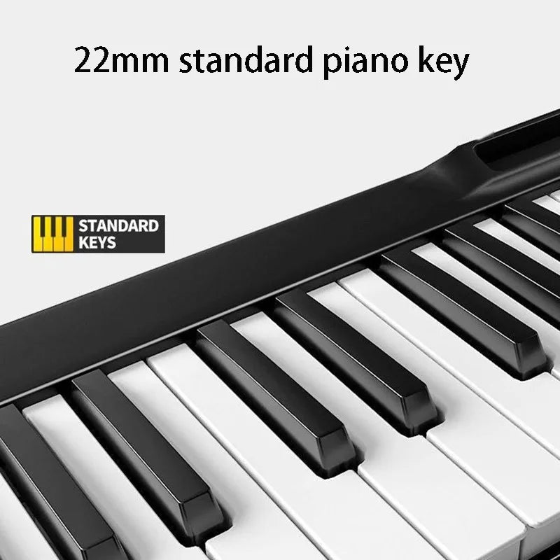 Black and white 22mm standard piano keys with glossy finish on a portable electronic piano for musical keyboard beginners