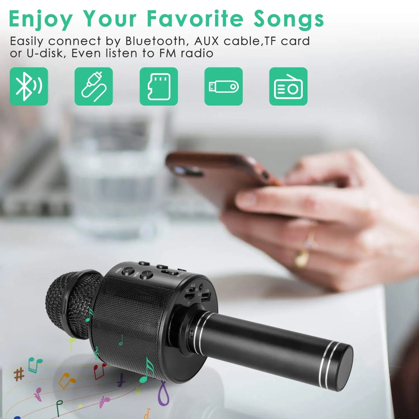 Black wireless karaoke microphone speaker with textured grille and silver accents for kids music player and singing recorder use