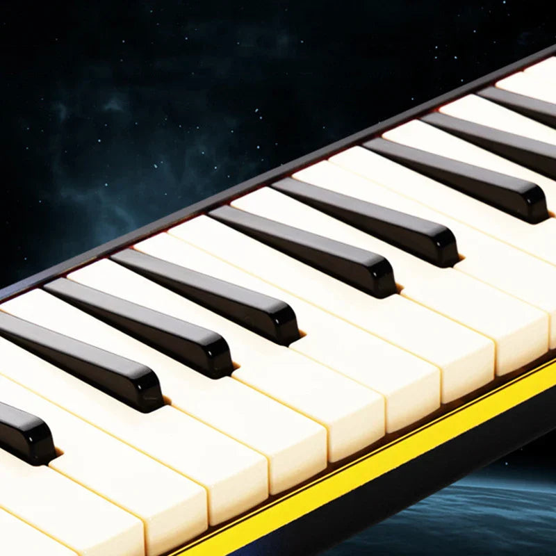 Black and ivory piano keys with glossy finish on yellow-trimmed portable melodica keyboard professional for children