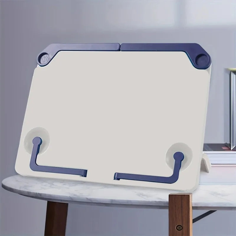 Cream-colored plastic portable music sheet stand with navy accents and suction cup feet foldable book stand desktop reading holder