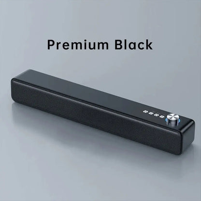 Premium black portable sound bar with sleek textured surface and silver control knob for bluetooth speaker and computer speakers aux use