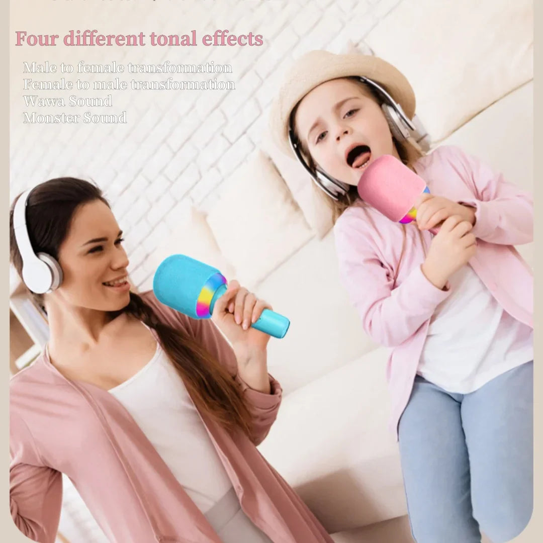 Portable speaker microphone combo in pink and blue with rainbow accent band and colorful atmosphere light for family singing fun