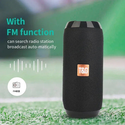 Black textured fabric portable speaker with copper t&g logo supports wireless bluetooth and long press volume key functions