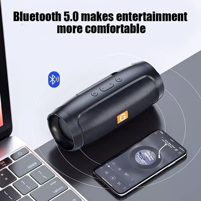 Black cylindrical portable subwoofer bluetooth speaker with textured grille and orange logo for outdoor wireless audio streaming