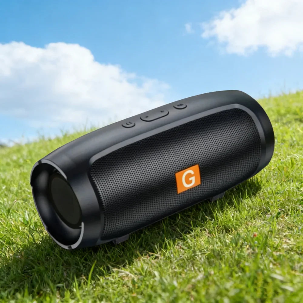 Black portable subwoofer bluetooth speaker with textured grille and orange g logo for outdoor stereo surround use