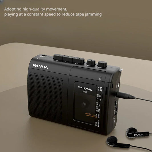 Black portable tape amfm radio retro cassette music player with textured grille control buttons and matching earphones