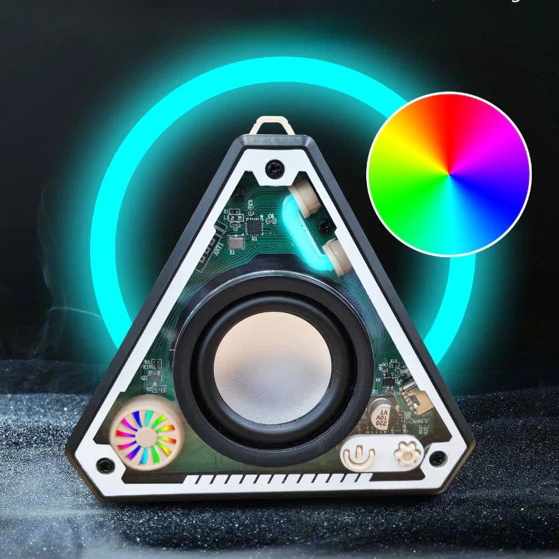 Triangular mini wireless bluetooth speaker with black and white frame, exposed circuit board, and colorful led lighting effects