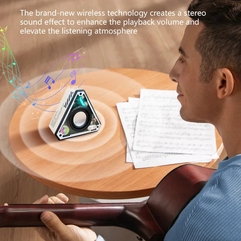 Triangular white and black mini wireless bluetooth speaker with circular driver and colorful led lights for outdoor use
