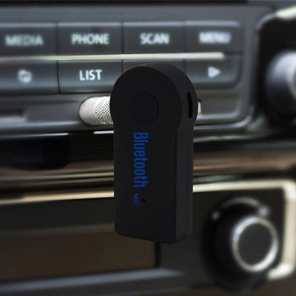 Black portable wireless bluetooth music receiver adapter with 3.5mm male audio and blue lettering for car stereo