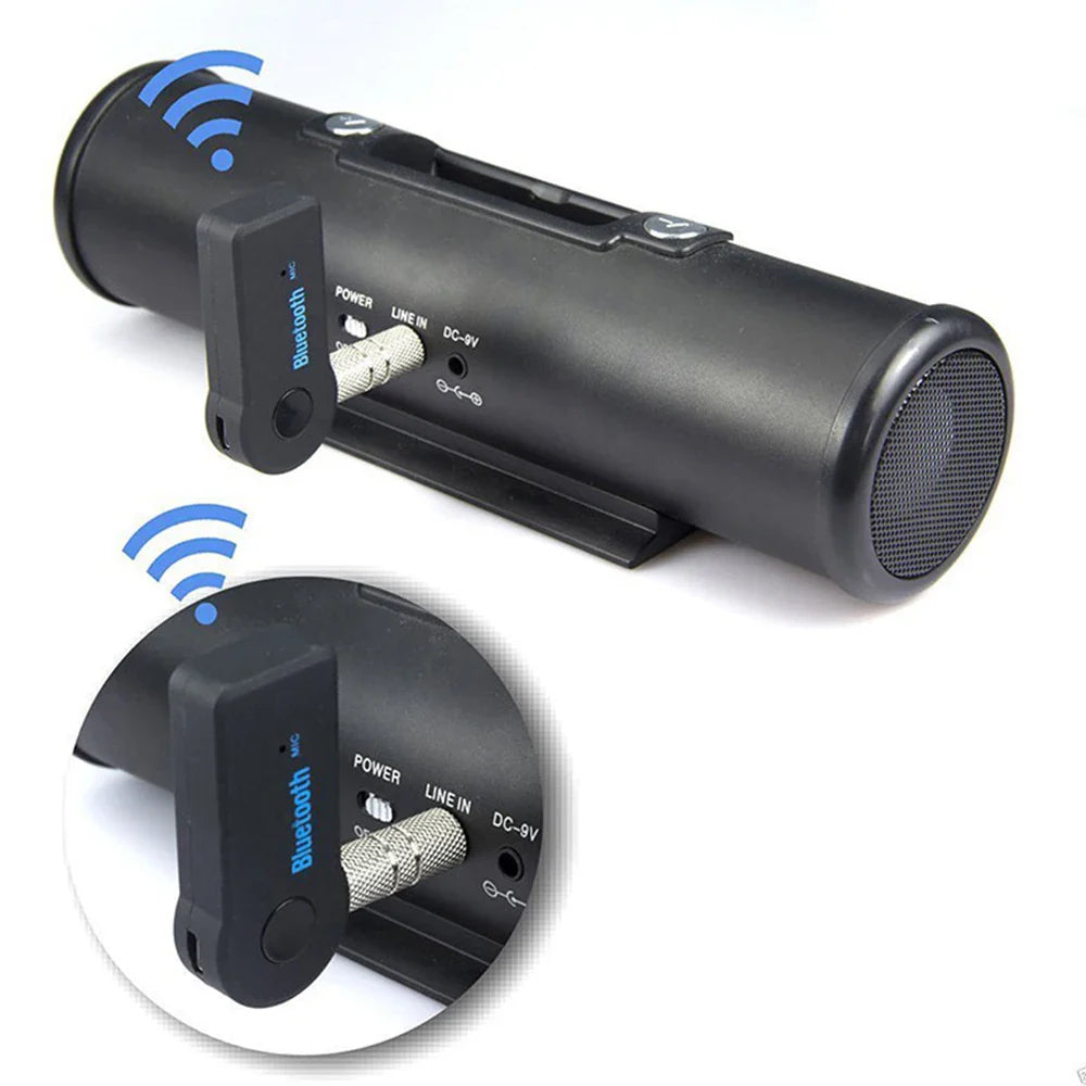 Black cylindrical portable wireless bluetooth-compatible music receiver with matte finish and 3.5mm male audio adapter