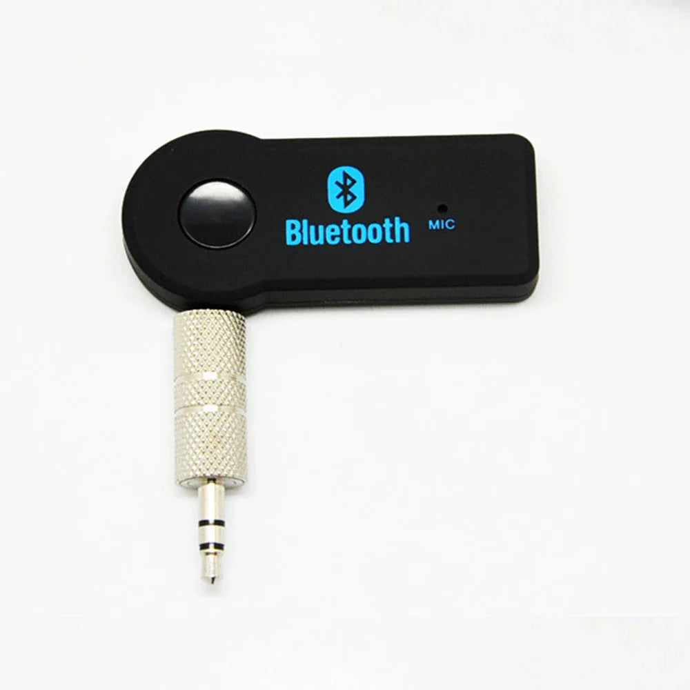 Black portable wireless bluetooth music receiver with silver 3.5mm male audio jack and textured metallic sleeve