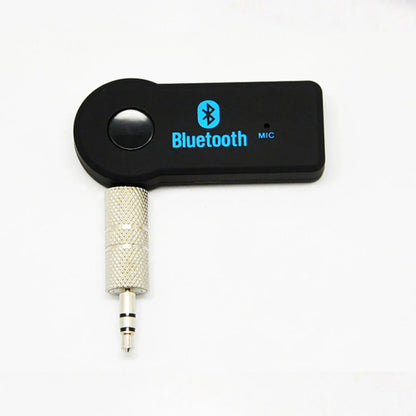 Black portable wireless bluetooth music receiver with silver 3.5mm male audio jack and textured metallic sleeve