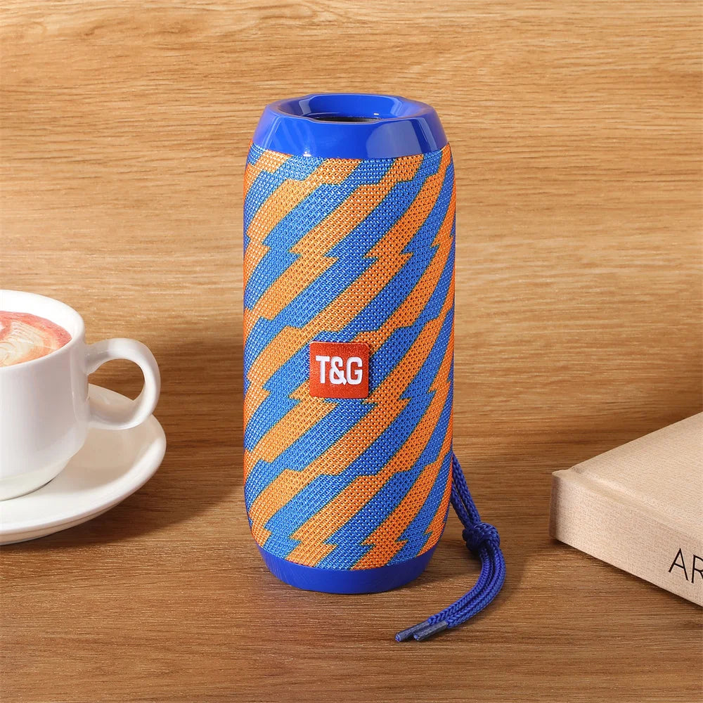 Portable wireless bluetooth speaker in blue and orange zigzag fabric with matching strap for som blootooth subwoofer radio fm handfree use