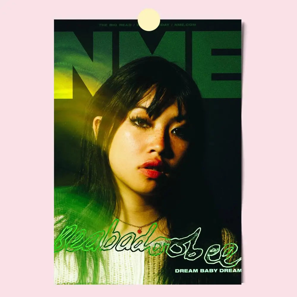 A modern graphic poster featuring a woman with dark hair and red lipstick against green and yellow lettering for home decor