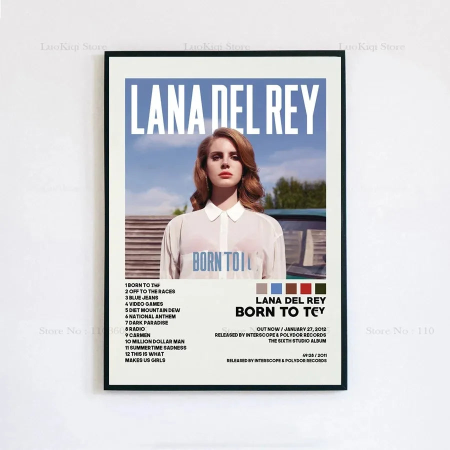 Black-framed poster print of lana del rey in white shirt with born to cry text against blue sky for home decor